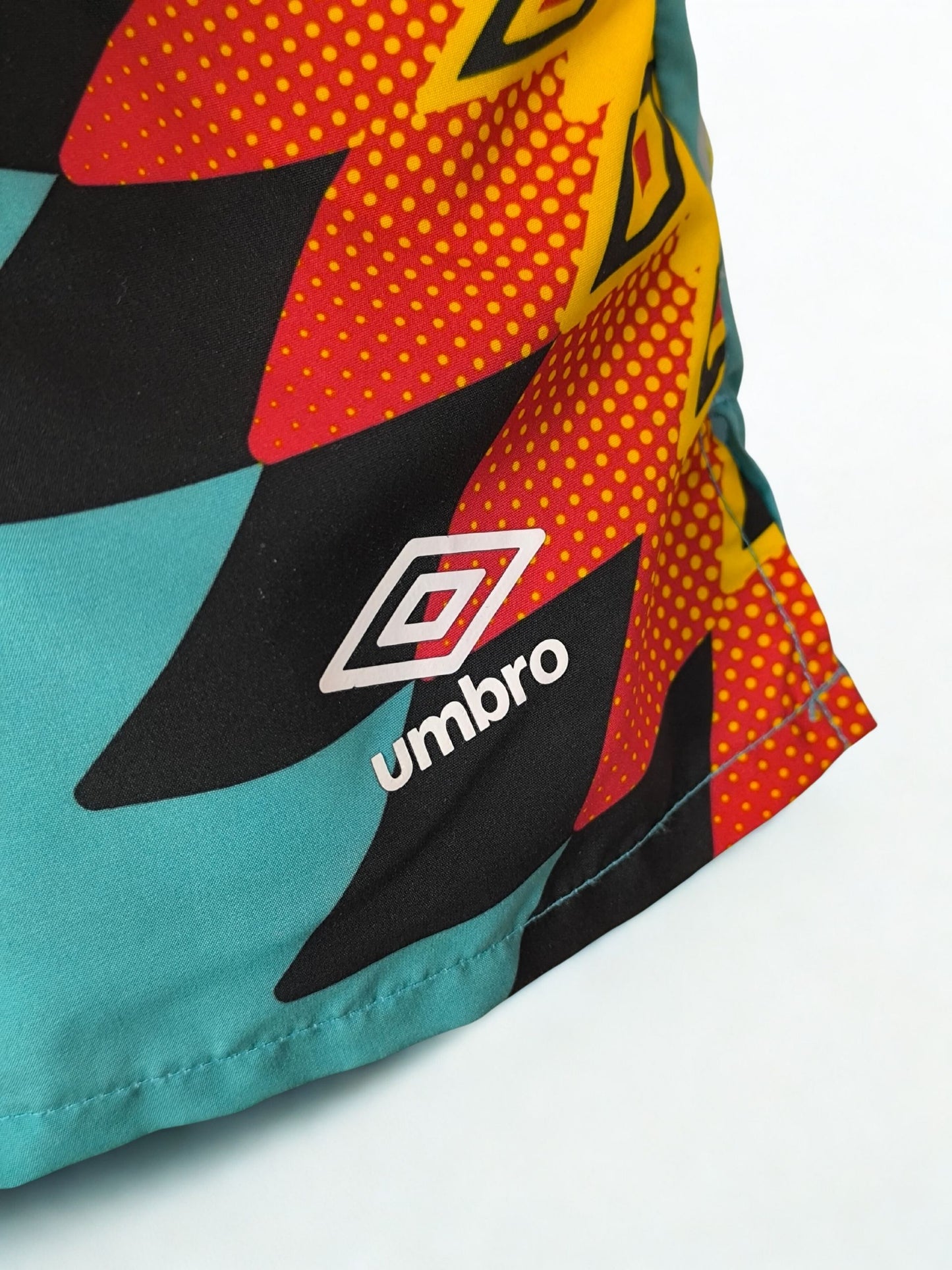 Retro Umbro Swim Shorts – Turquoise with Tribal Flame Print