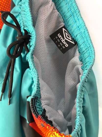 Retro Umbro Swim Shorts – Turquoise with Tribal Flame Print